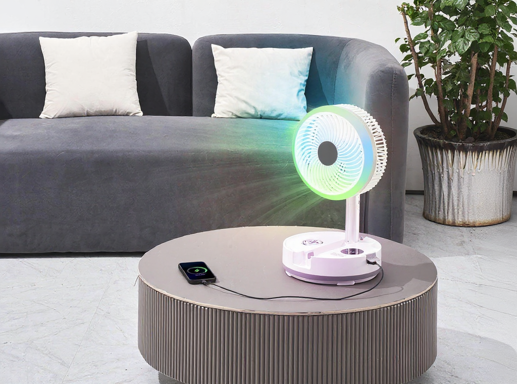 Foldable rechargeable oscillating fan in a living room