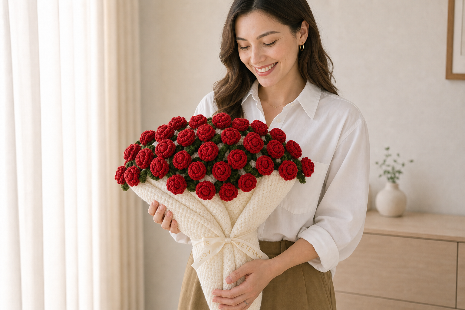 Woman holding a rose bouquet blanket in a neutral home setting.